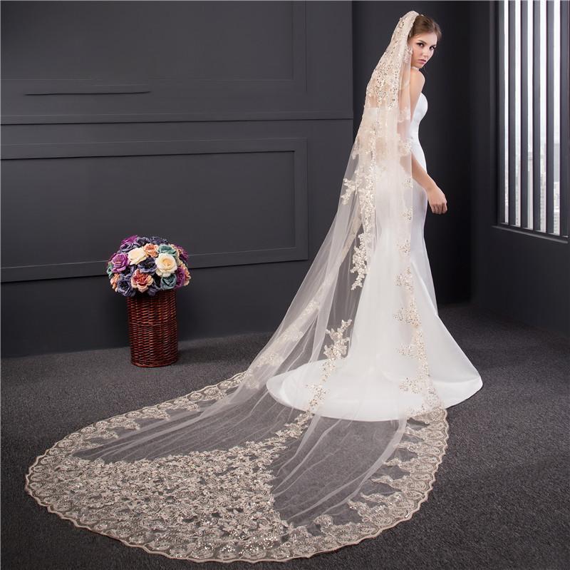 http://www.yourweddingveilstore.com/cdn/shop/products/cathedral-veil-with-dramatic-beaded-lace-applique-three-colors-3_1200x1200.jpg?v=1526044768