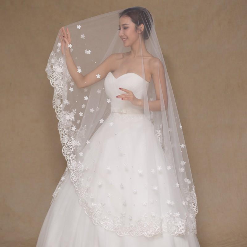 http://www.yourweddingveilstore.com/cdn/shop/products/cathedral-veil-with-scalloped-lace-flower-applique-and-beading-2_1200x1200.jpg?v=1524415634